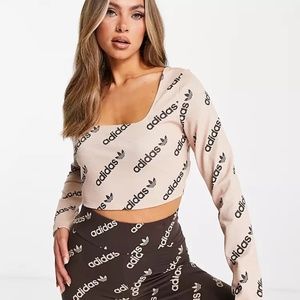 Adidas Originals 'Logomania' repeat logo long sleeve cropped top